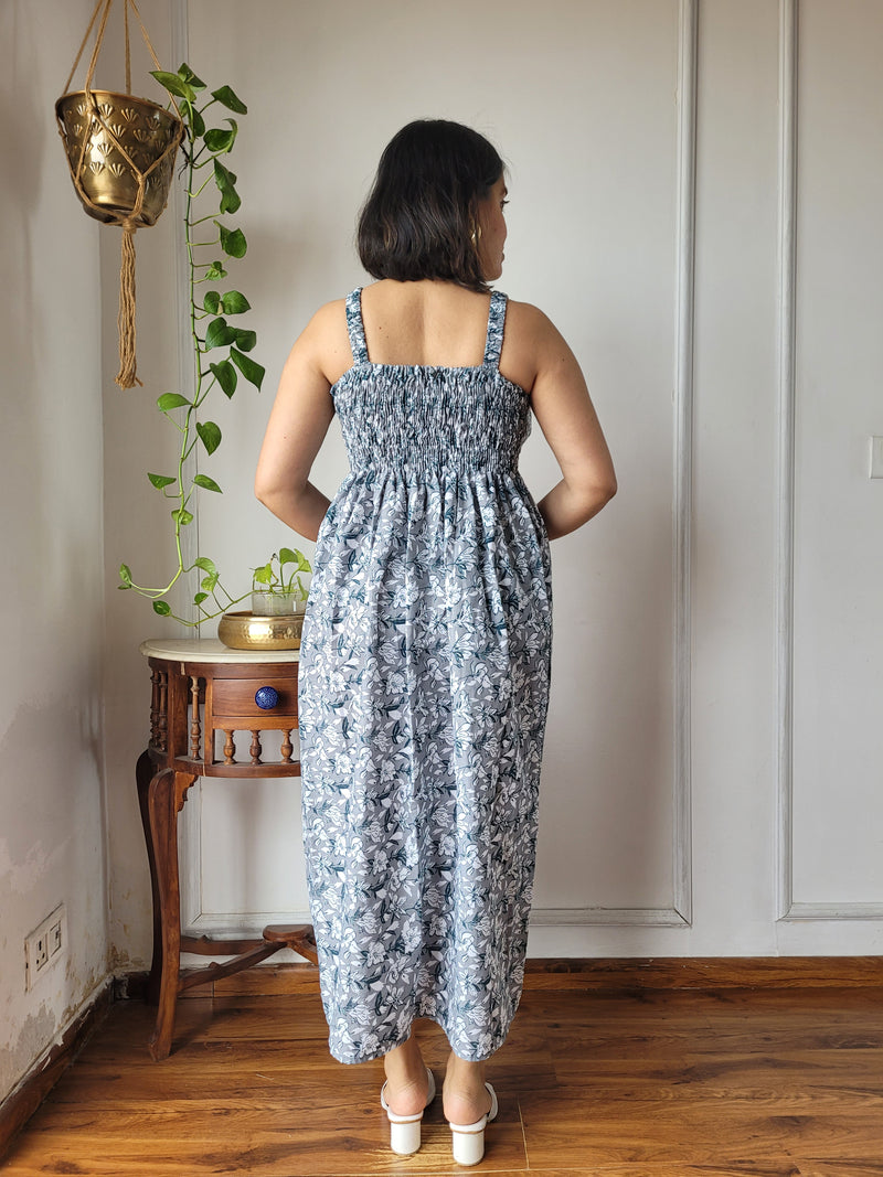 Women wearing grey floral printed smocked cotton midi dress