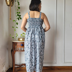 Women wearing grey floral printed smocked cotton midi dress