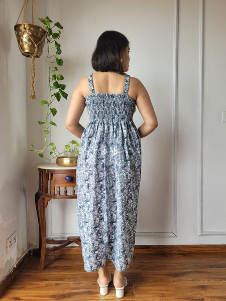 Women wearing grey floral printed smocked cotton midi dress