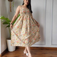 Women wearing cream mustard and pink floral printed smocked cotton midi dress