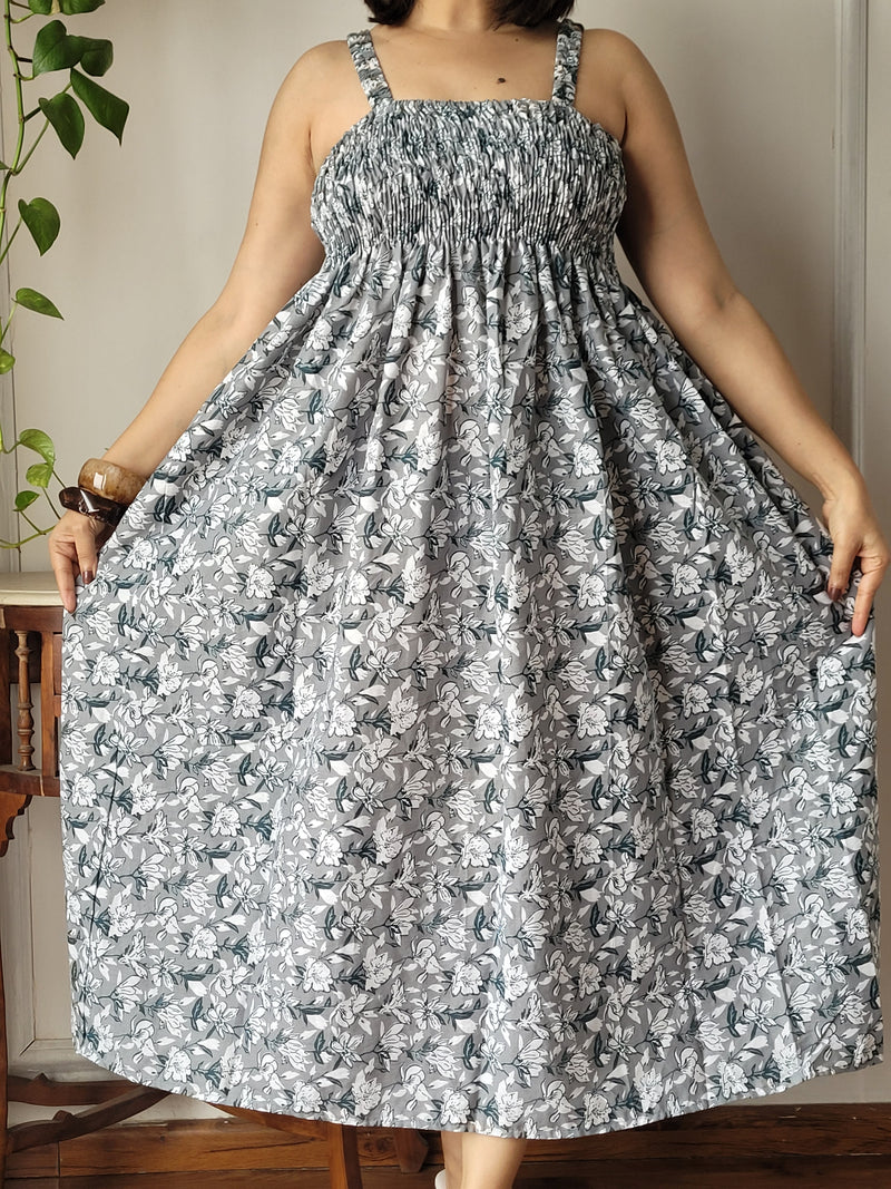 Women wearing beige floral printed smocked cotton midi dress