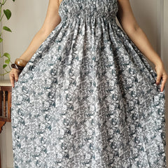 Women wearing beige floral printed smocked cotton midi dress