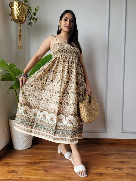 Women wearing olive green and cream floral peacock border printed smocked cotton midi dress