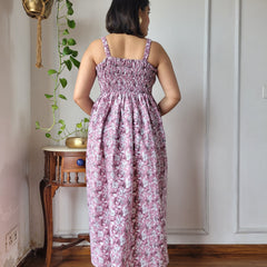Women wearing pink floral printed smocked cotton midi dress