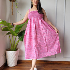Women wearing pink booti printed smocked cotton midi dress