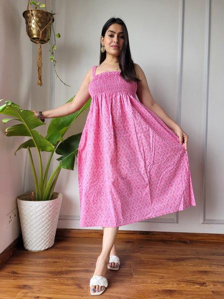 Women wearing pink booti printed smocked cotton midi dress