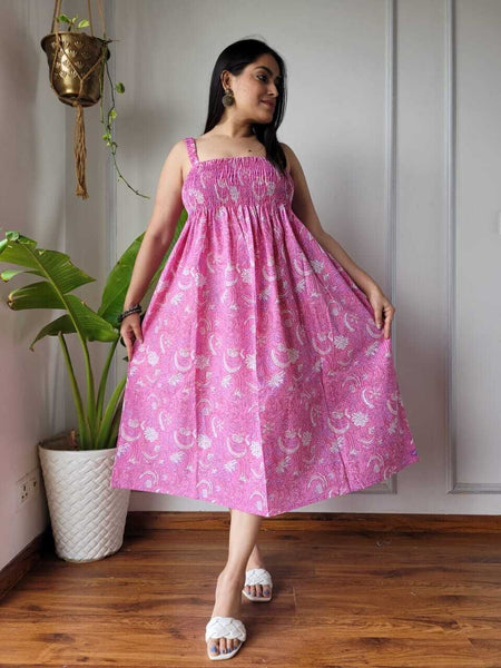 Women wearing pink jaal printed smocked cotton midi dress
