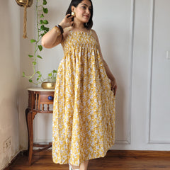 Women Mustard Yellow Floral Printed Smocked Cotton Midi Dress - Flowy Flare View