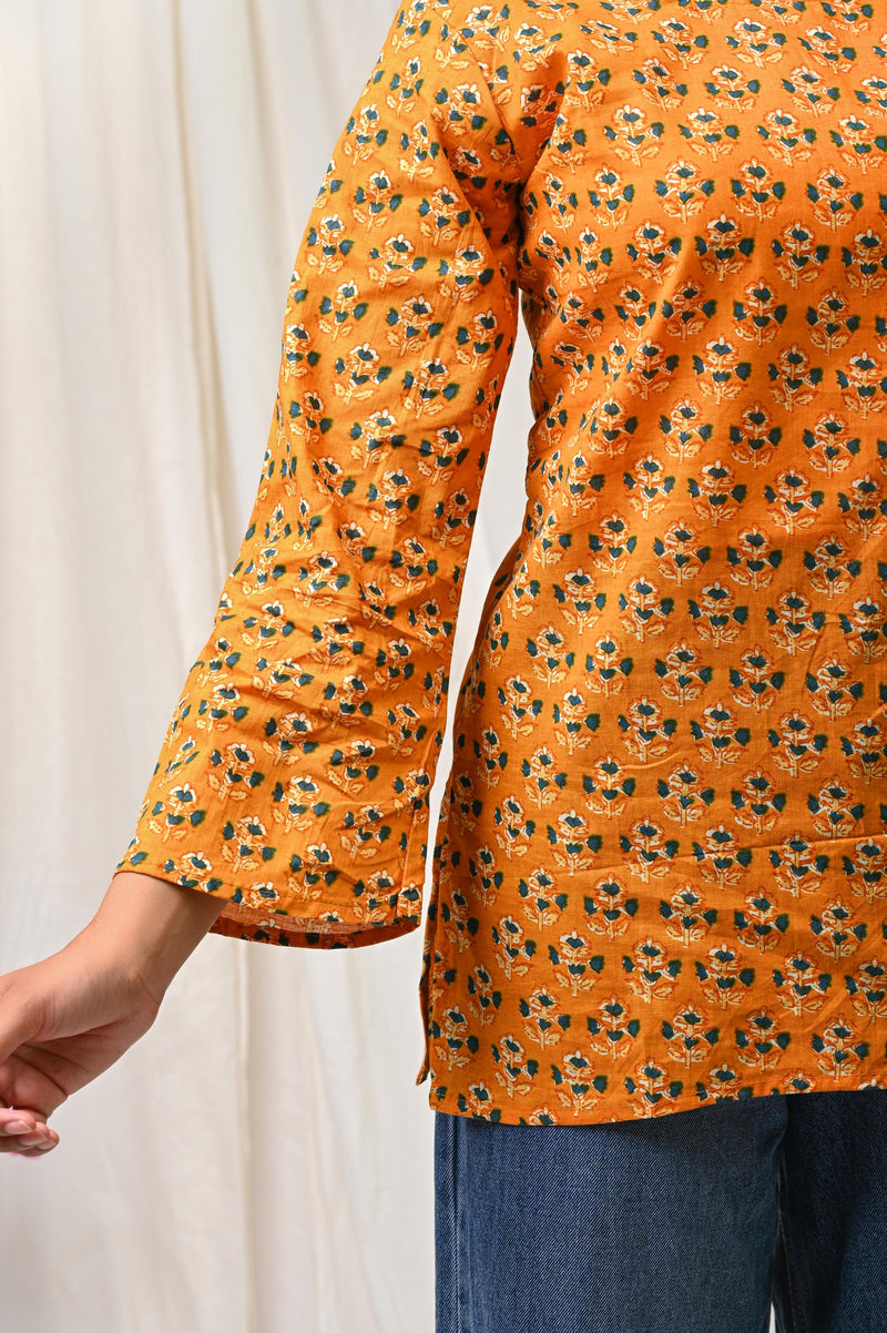 Orange floral printed cotton short kurti for women