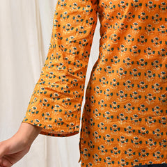 Orange floral printed cotton short kurti for women