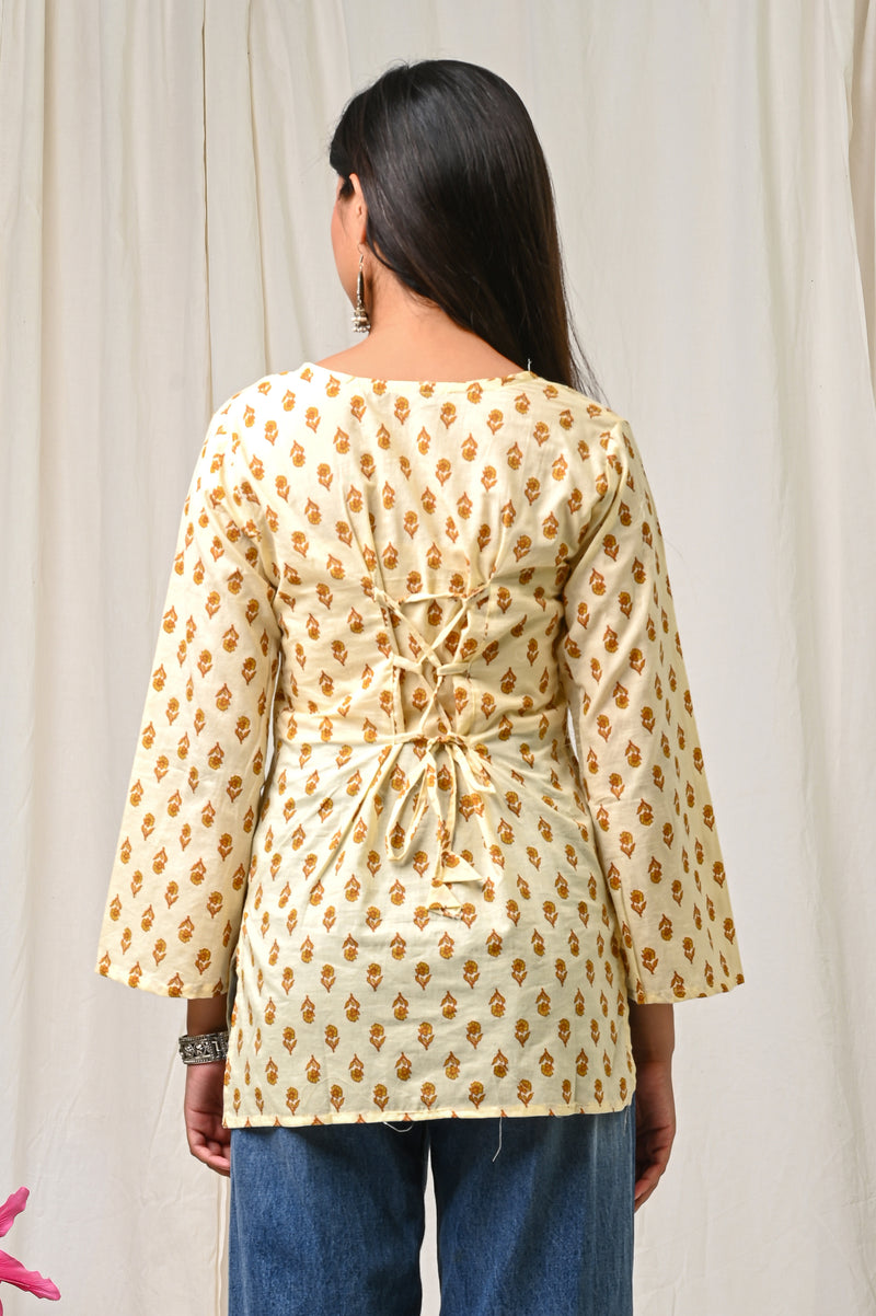 Women Cream Mustard Printed Cotton Short Kurti - Side / Back View